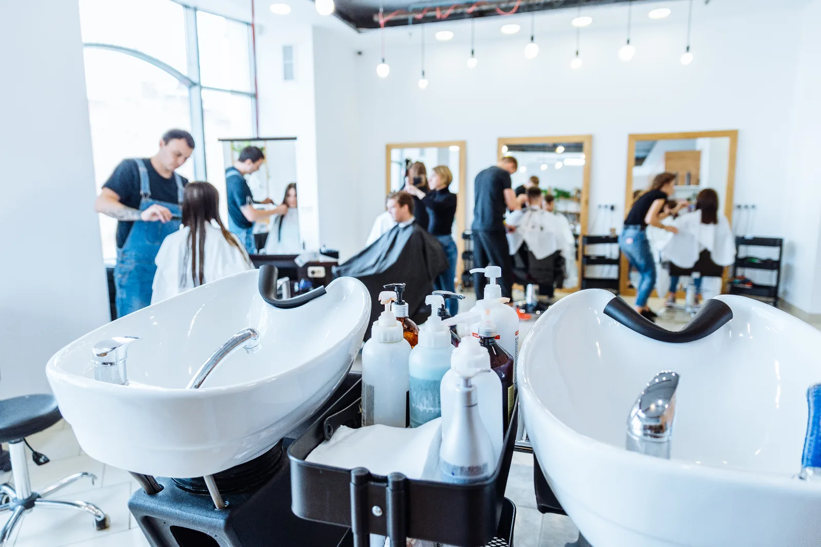 A stylist at work in a light-filled boutique salon